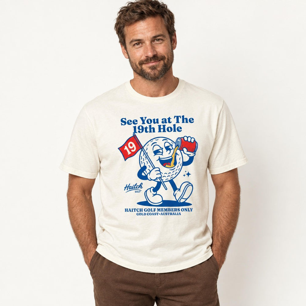 Man wearing the Haitch Golf 19th Hole Members Club tee in Natural