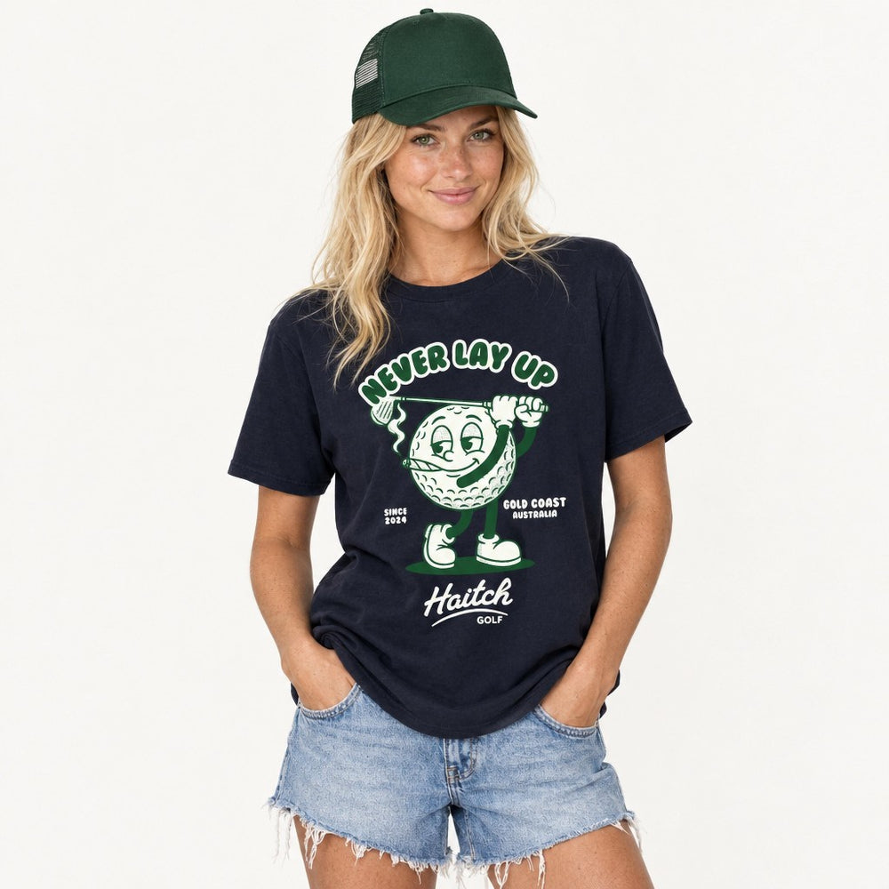 Man wearing the Haitch Golf Never Lay Up tee in Navy