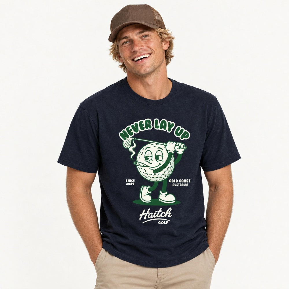 Man wearing the Haitch Golf Never Lay Up tee in Navy