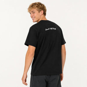 A man wearing a black short-sleeve t-shirt with 'Smash Golf Balls' printed in white script on the back, photographed against a clean white studio background.