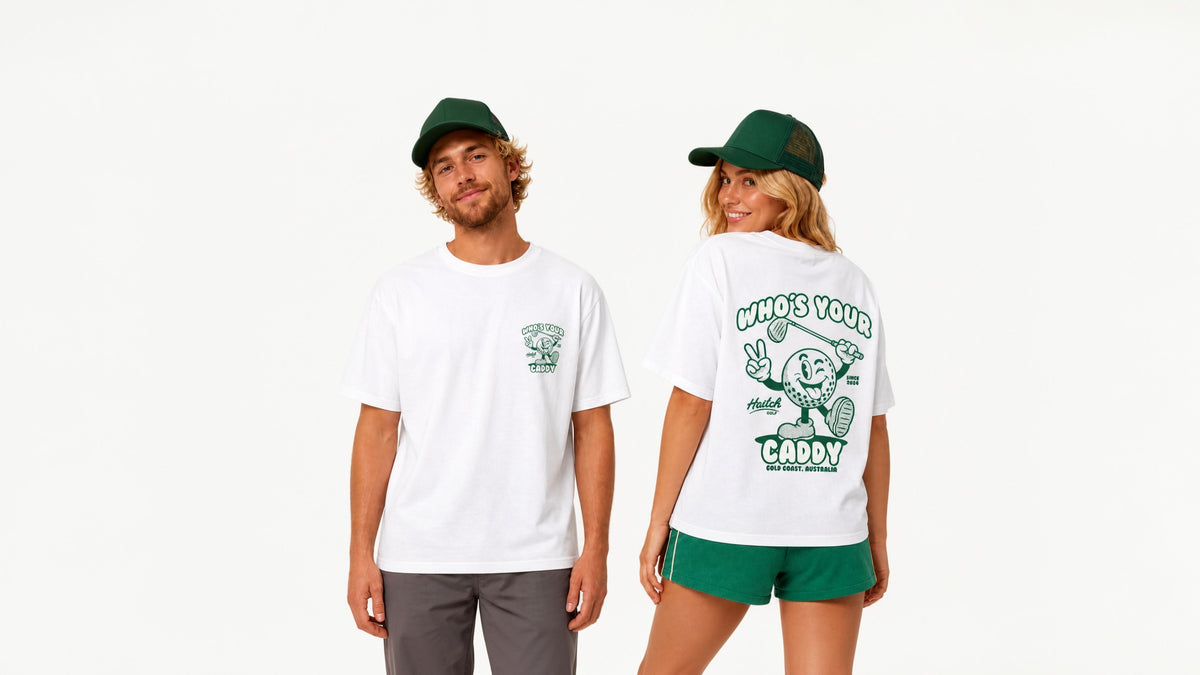 Two models wearing a white t-shirt with green graphics and matching green shorts and cap, shown from the front and back against a plain white background.