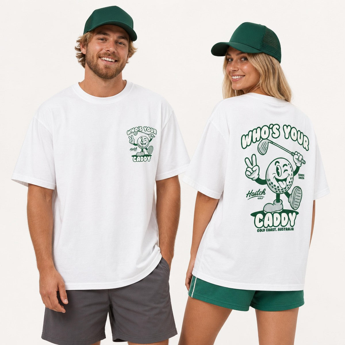 A man and a woman modeling white graphic t-shirts with green accents. The man is shown from the front wearing a green cap and gray shorts, while the woman is shown from the back wearing a green cap and green shorts.